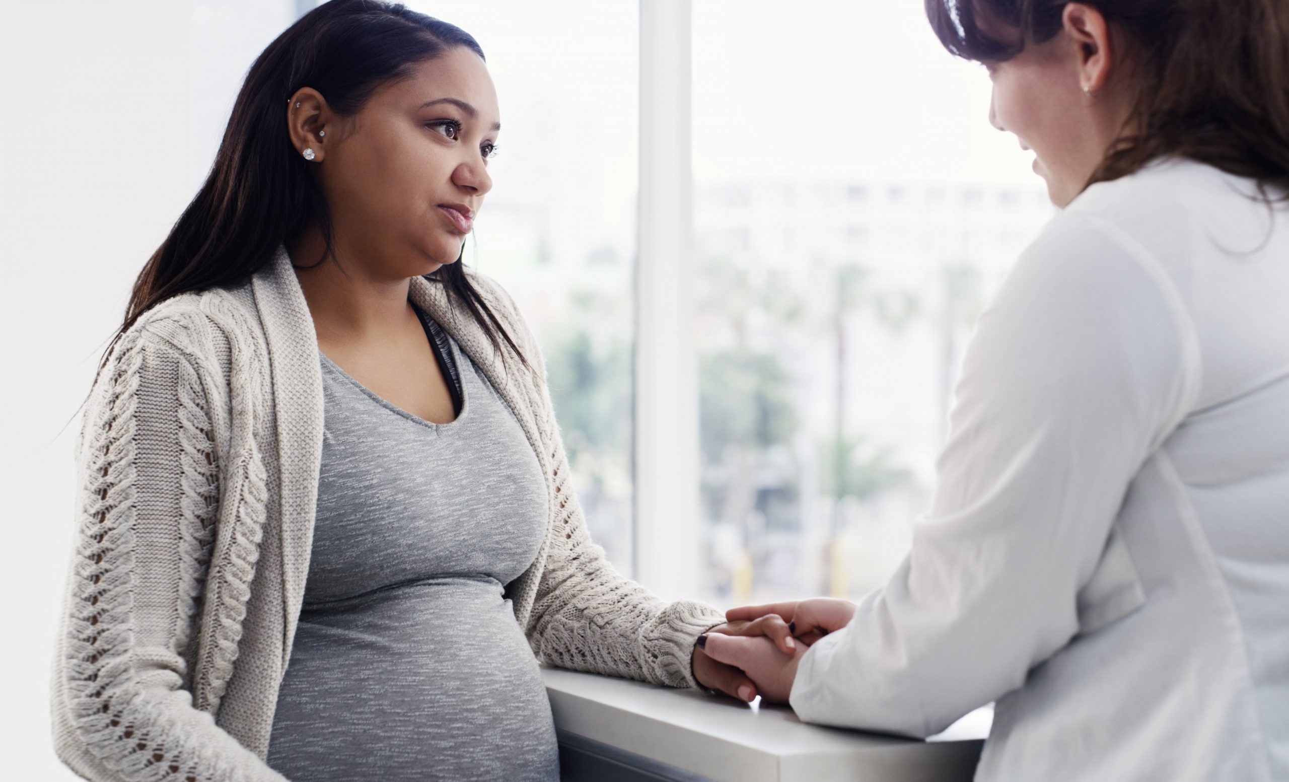Shot of a pregnant young woman having a consultation with her doctor at a clinic
